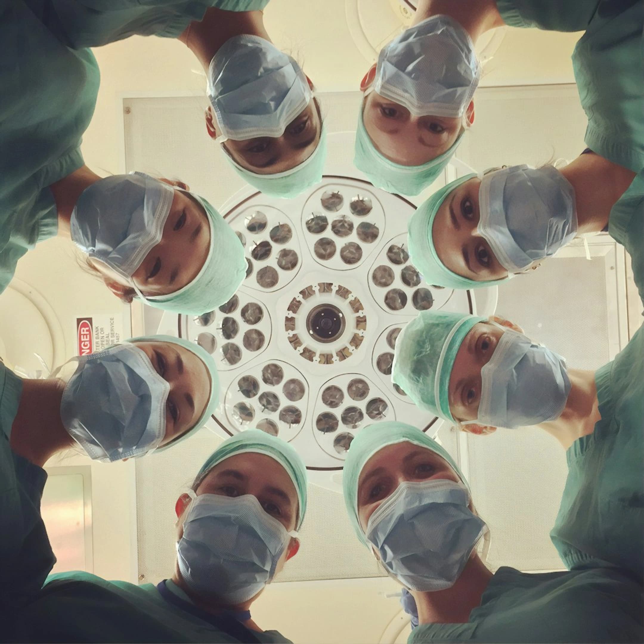 Medical professionals in white coats standing together in a modern clinic setting